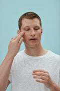 Man applying American Boxer Face Serum on his face